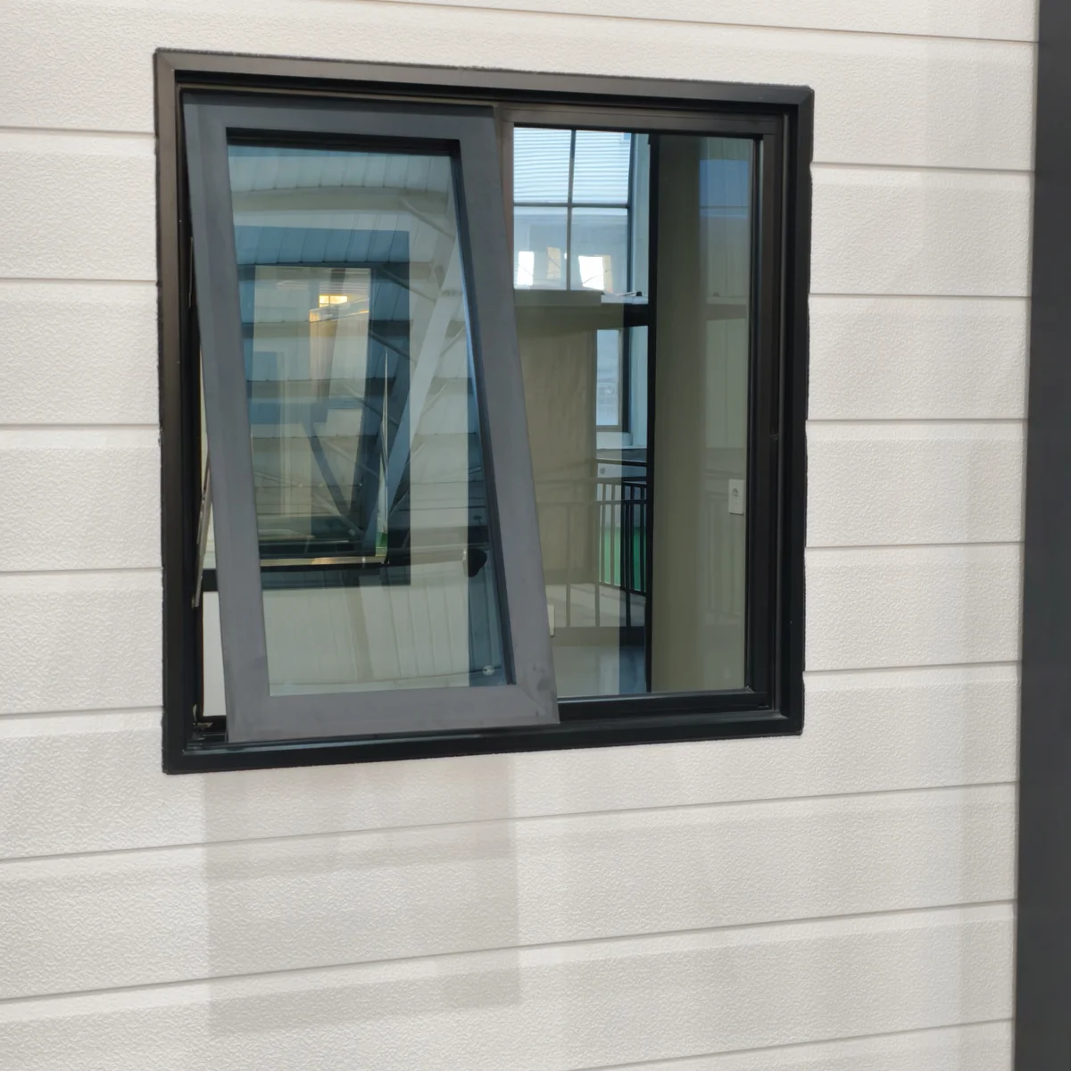 Window framing and exterior panel details on a finished modular unit
