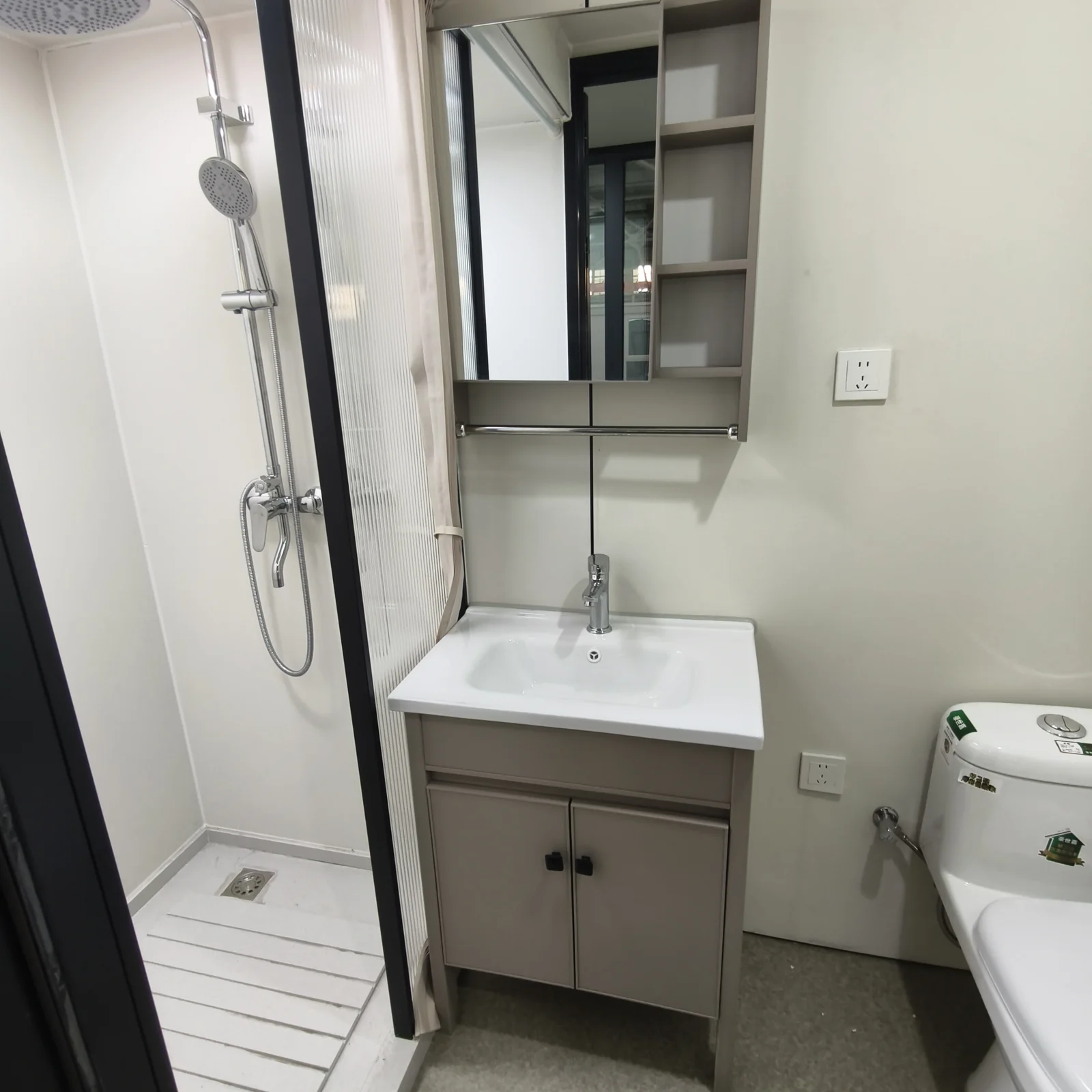 White facade Apple Cabin bathroom