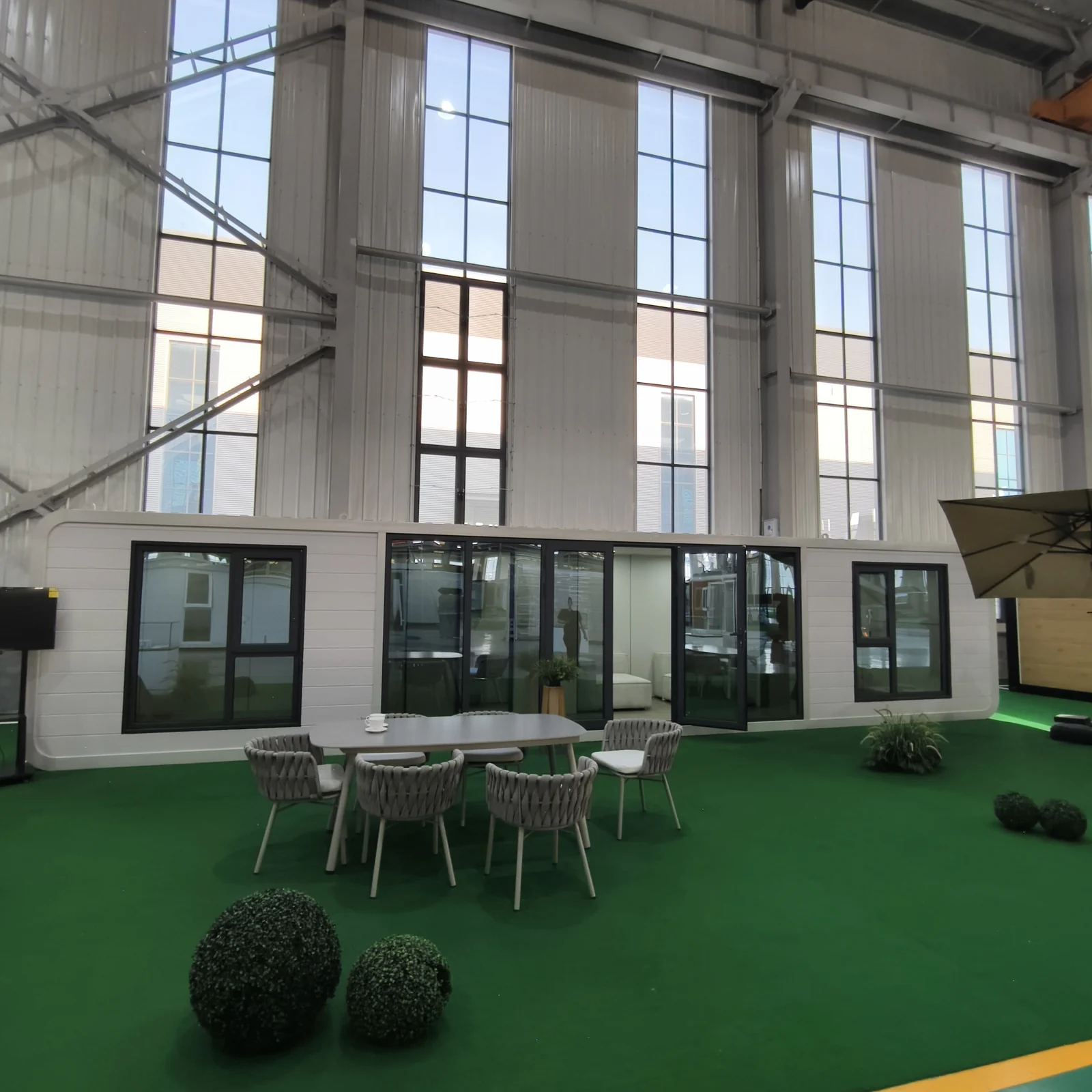 White facade Apple Cabin showroom sample